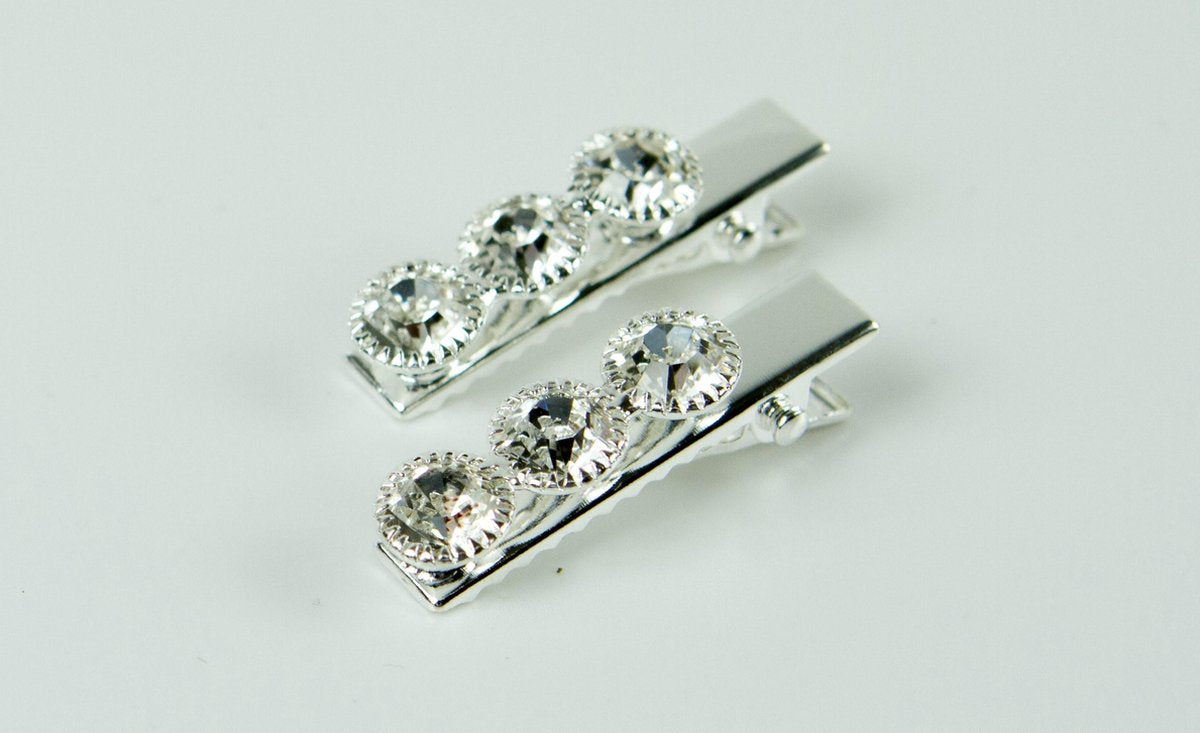 Duckklem zilverkleurig 3 strass stenen