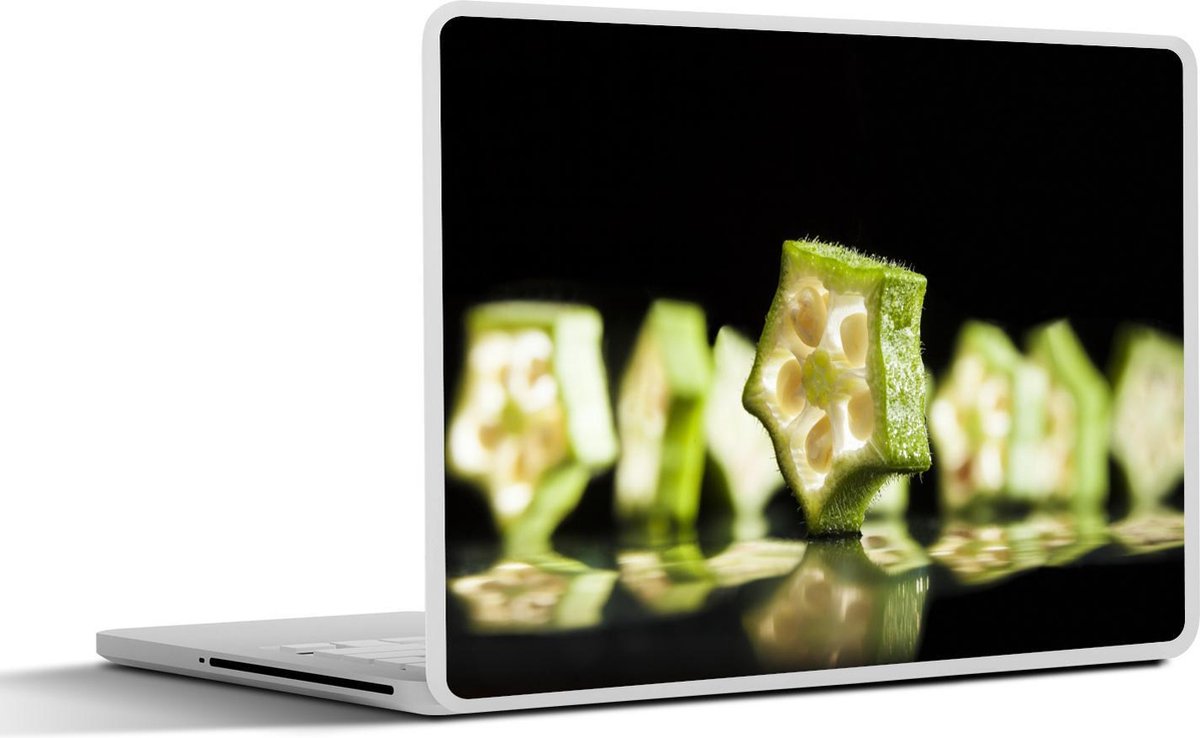 Laptop sticker - 10.1 inch - Afbeelding van een plakje okra met een zwarte achtergrond