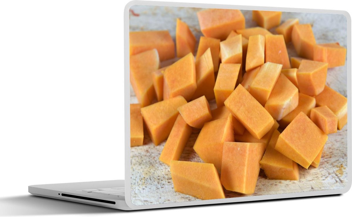 Laptop sticker - 10.1 inch - In blokjes gesneden muskaatpompoen op een grijze snijplank