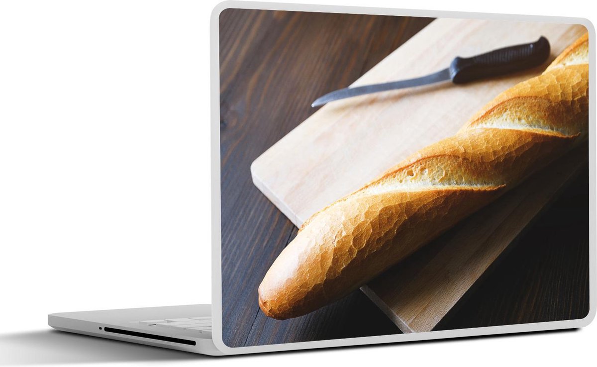 Laptop sticker - 10.1 inch - Afgebakken stokbrood liggend op een broodplank