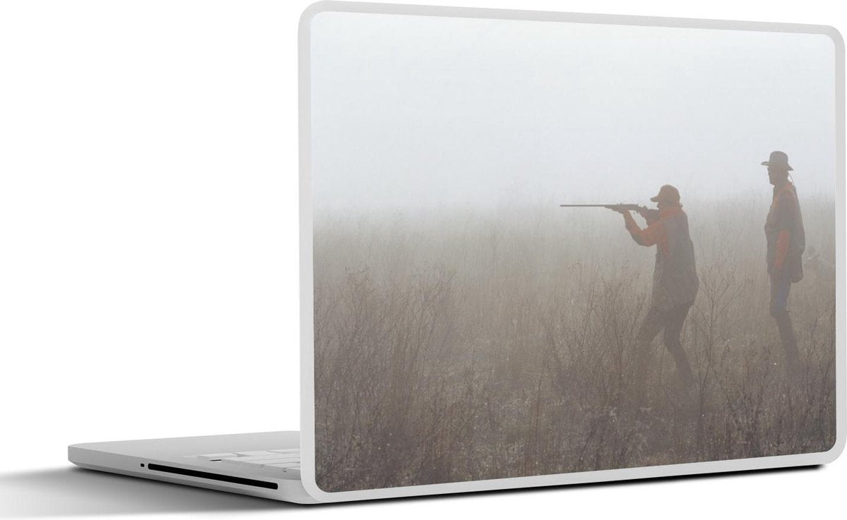 Laptop sticker - 10.1 inch - In een mistig veld jagen twee mannen op dieren