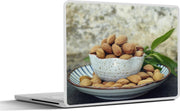 Laptop sticker - 10.1 inch - Amandelen in een decoratieve kom op een schaaltje