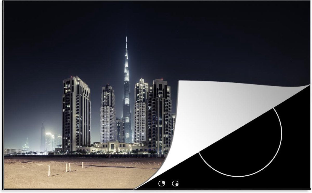 Luxe inductie beschermer Dubai - 80x52 cm - Burj Khalifa verlicht met andere wolkenkrabbers lucht boven Dubai  - inductiebeschermer
