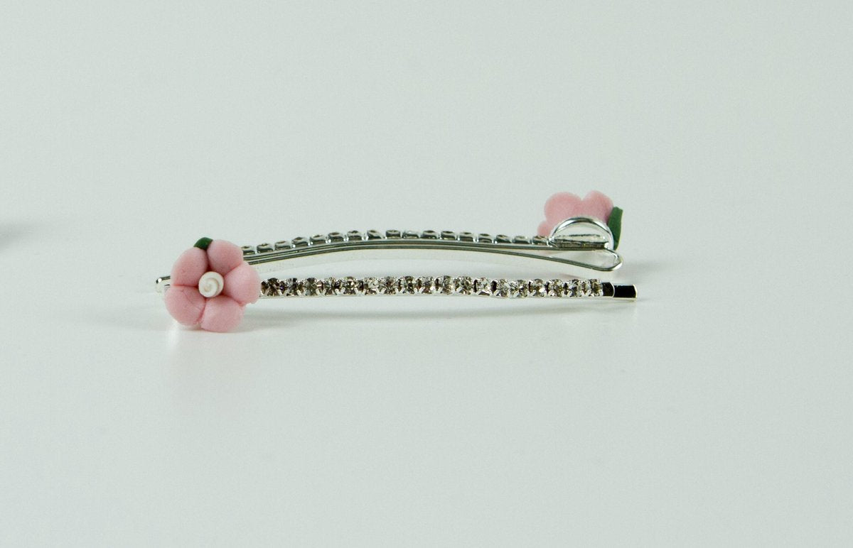 Schuifspelden strass met roze bloem