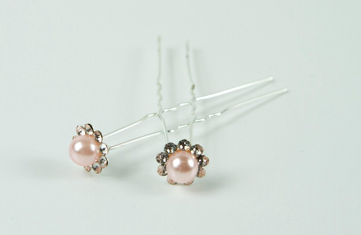 Haarpinnen parel licht roze met strass.
