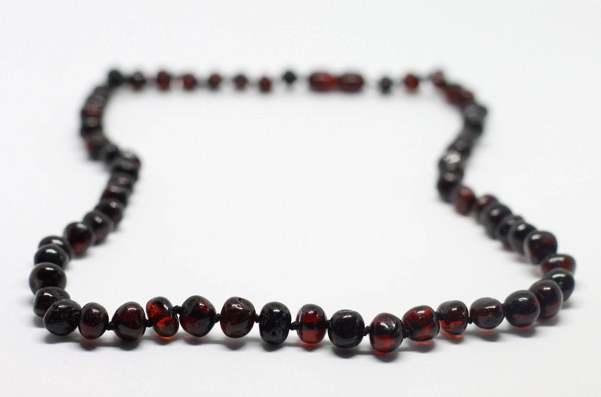 Barnsteen babyketting  - Black Polished | Amber | Pijnstillende werking bij doorkomende tandjes |  Handgemaakt | Gratis verzending | Kidzstore.eu