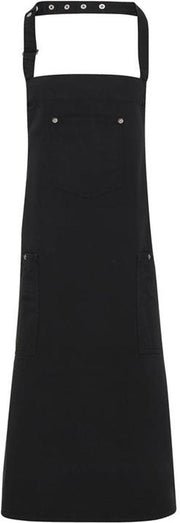 Schort kleur Zwart PR 132 | 100% twillkatoen | Dit schort met bovenstuk kreeg details die aan de klassieke 'chino' doen denken | horeca kleding