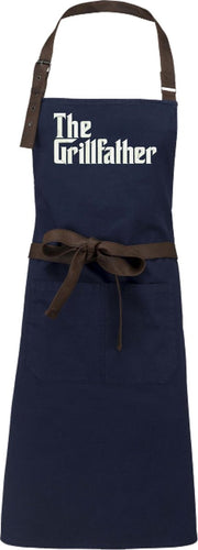 APRON NAVY  (Keukenschort-Kokschort-kookschort-Halterschort) geborduurd in de kleur wit  (THE GRILLFATHER)