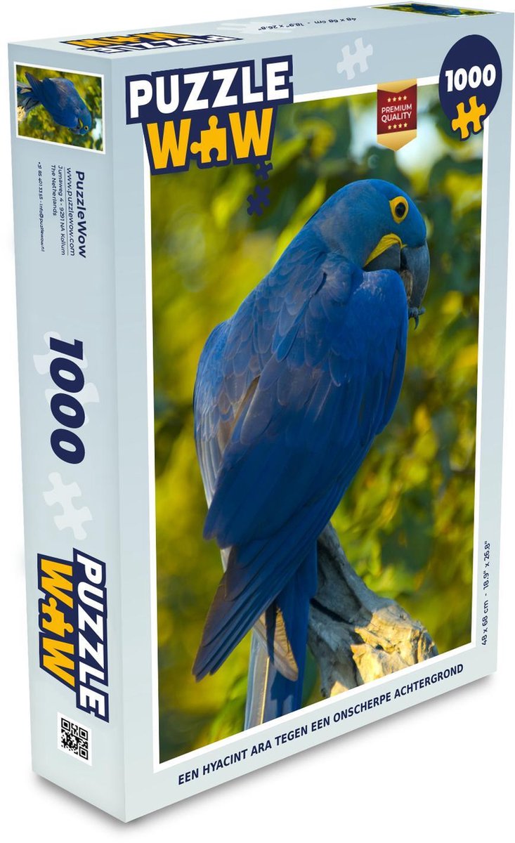 Puzzel 1000 stukjes volwassenen Hyacint ara 1000 stukjes - Een hyacint ara tegen een onscherpe achtergrond  - PuzzleWow heeft +100000 puzzels