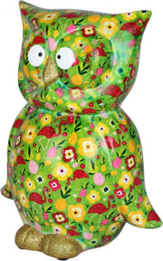 Pomme pidou spaarpot uil 'Big Bo' XL groen met een opdruk van bloemetjes en flamingo's