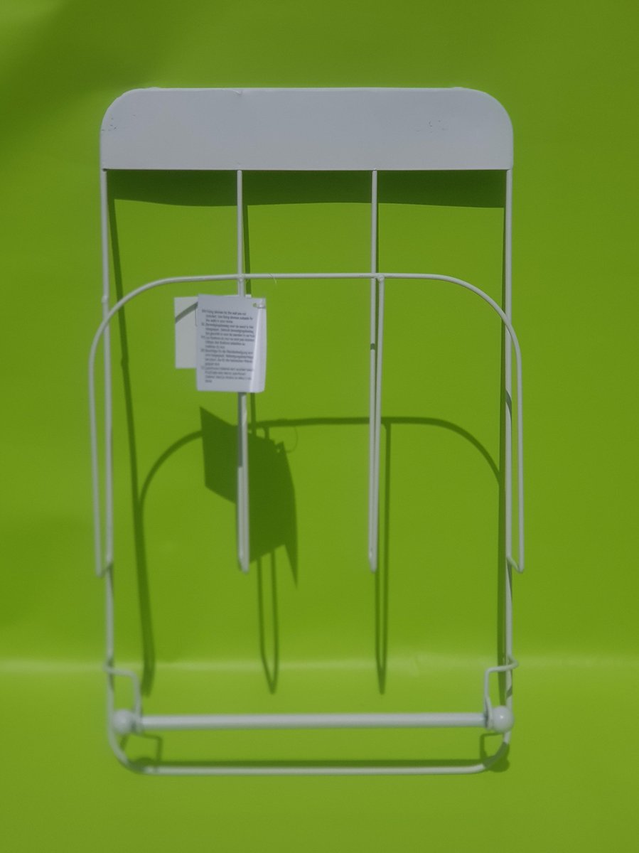 Metal magazine rack with roll holder