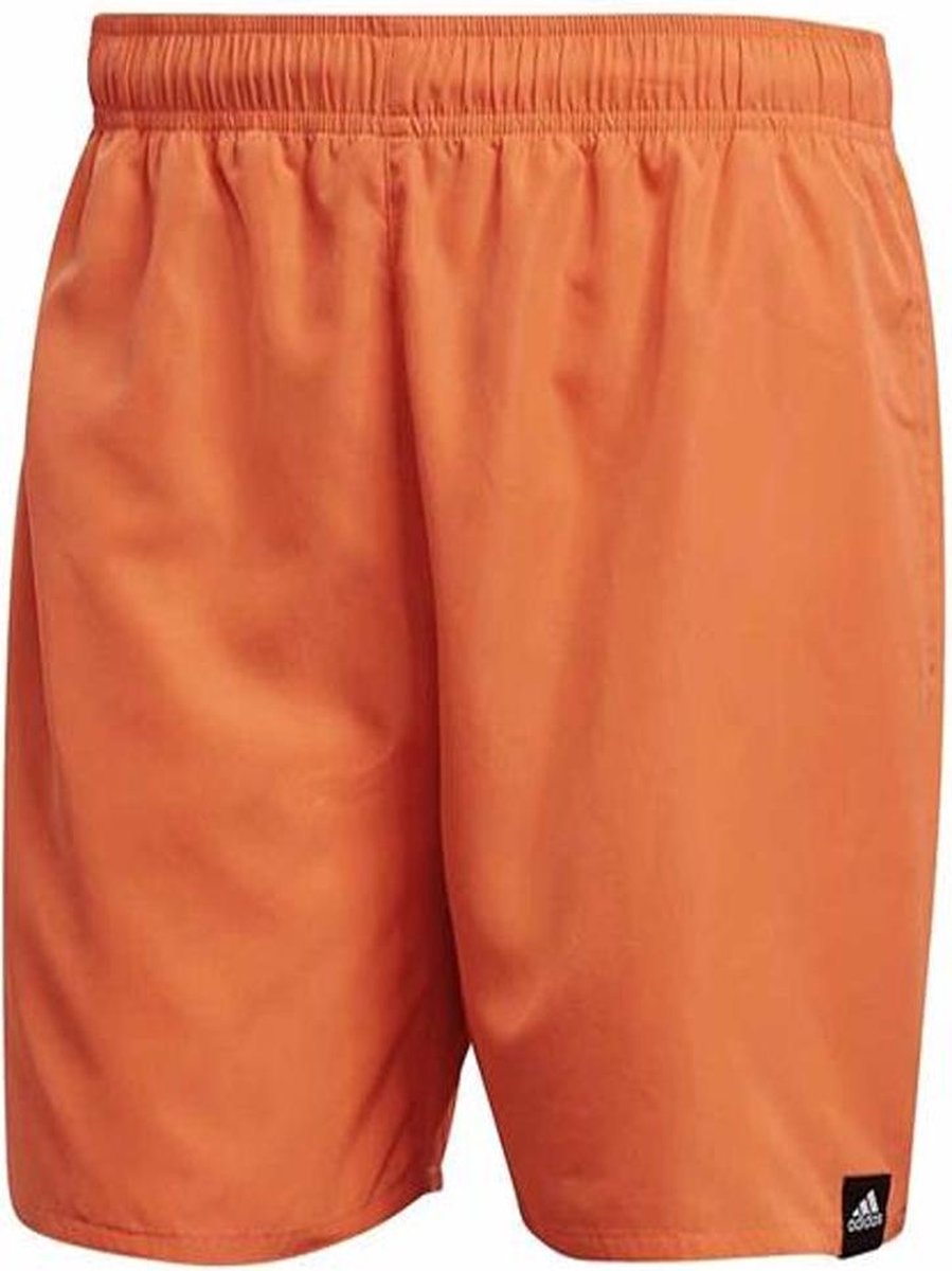 Adidas solid zwemshort in de kleur oranje.